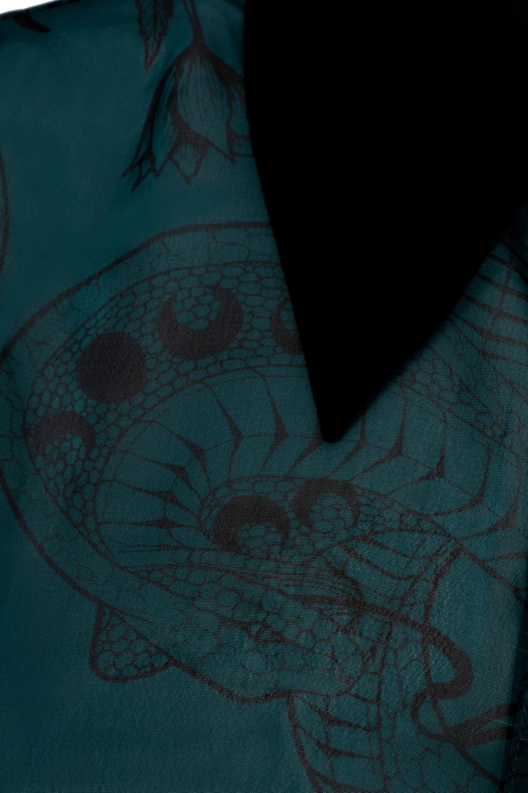 Teal fabric with red snake design and black border