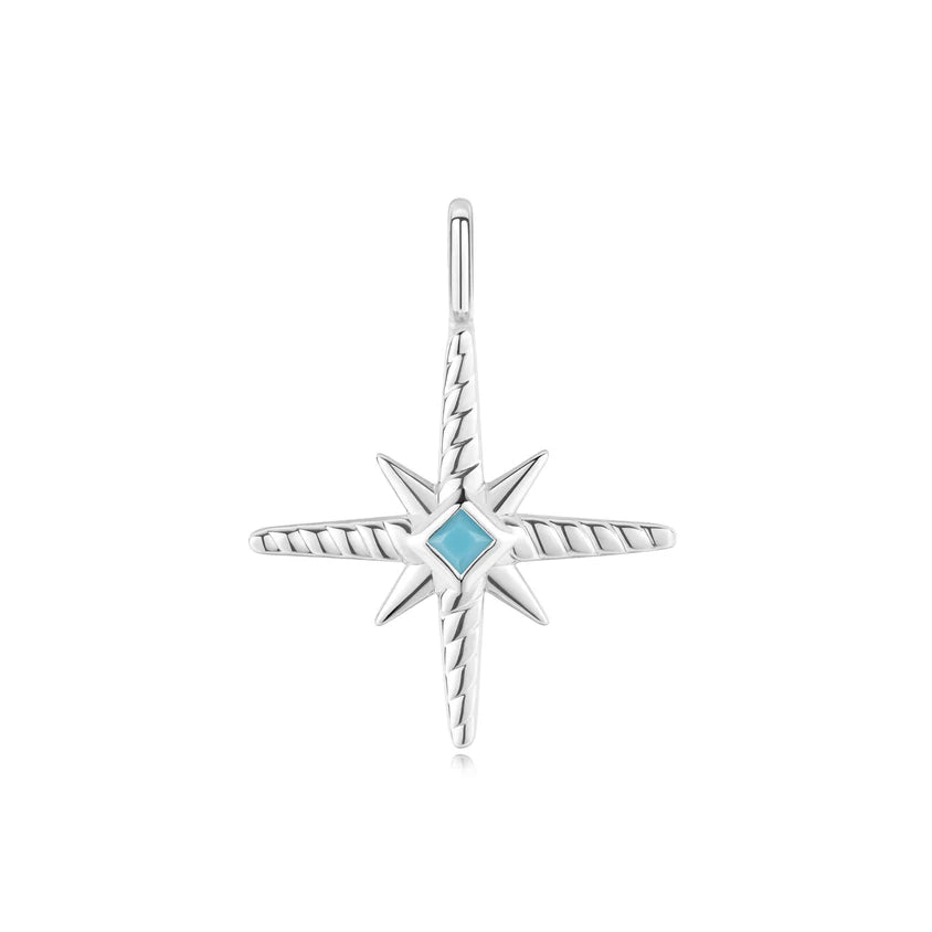 Silver star-shaped pendant with a blue gemstone on a white background