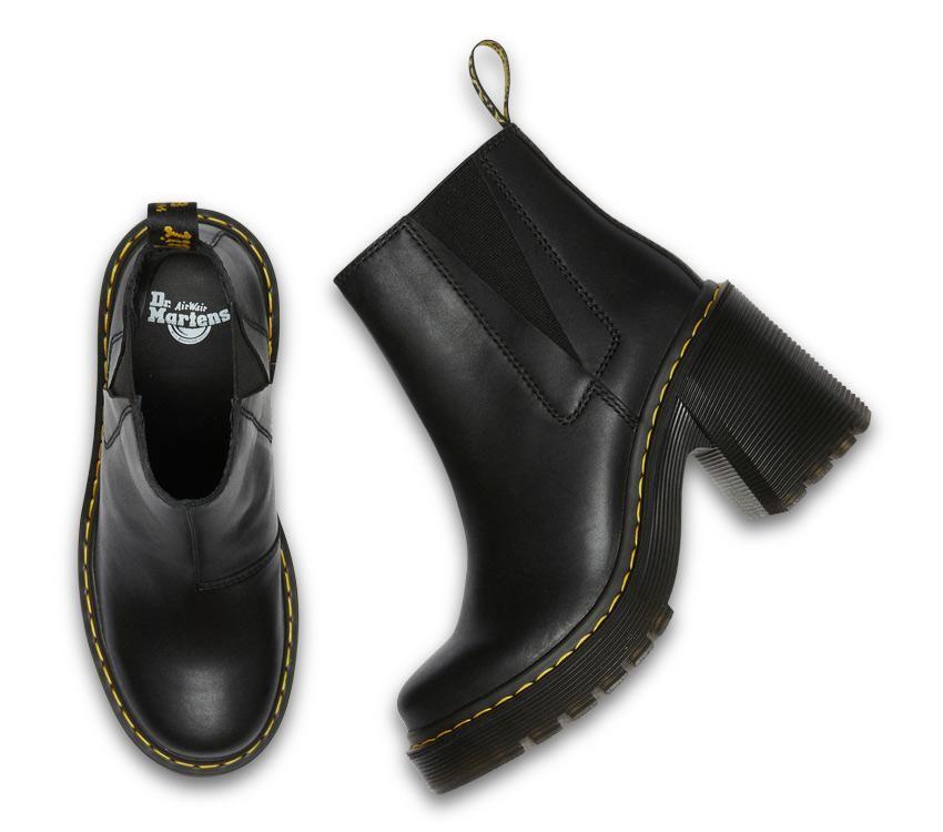 A pair of black Dr Martens Spence leather boots with a grooved outsole and flared heel, featuring a smooth full-grain finish.